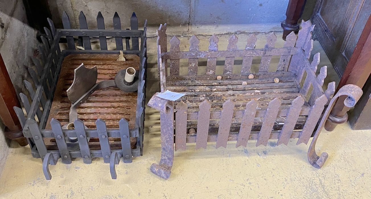 Two wrought iron fire grates, larger width 47cm and a cast metal two branch wall light